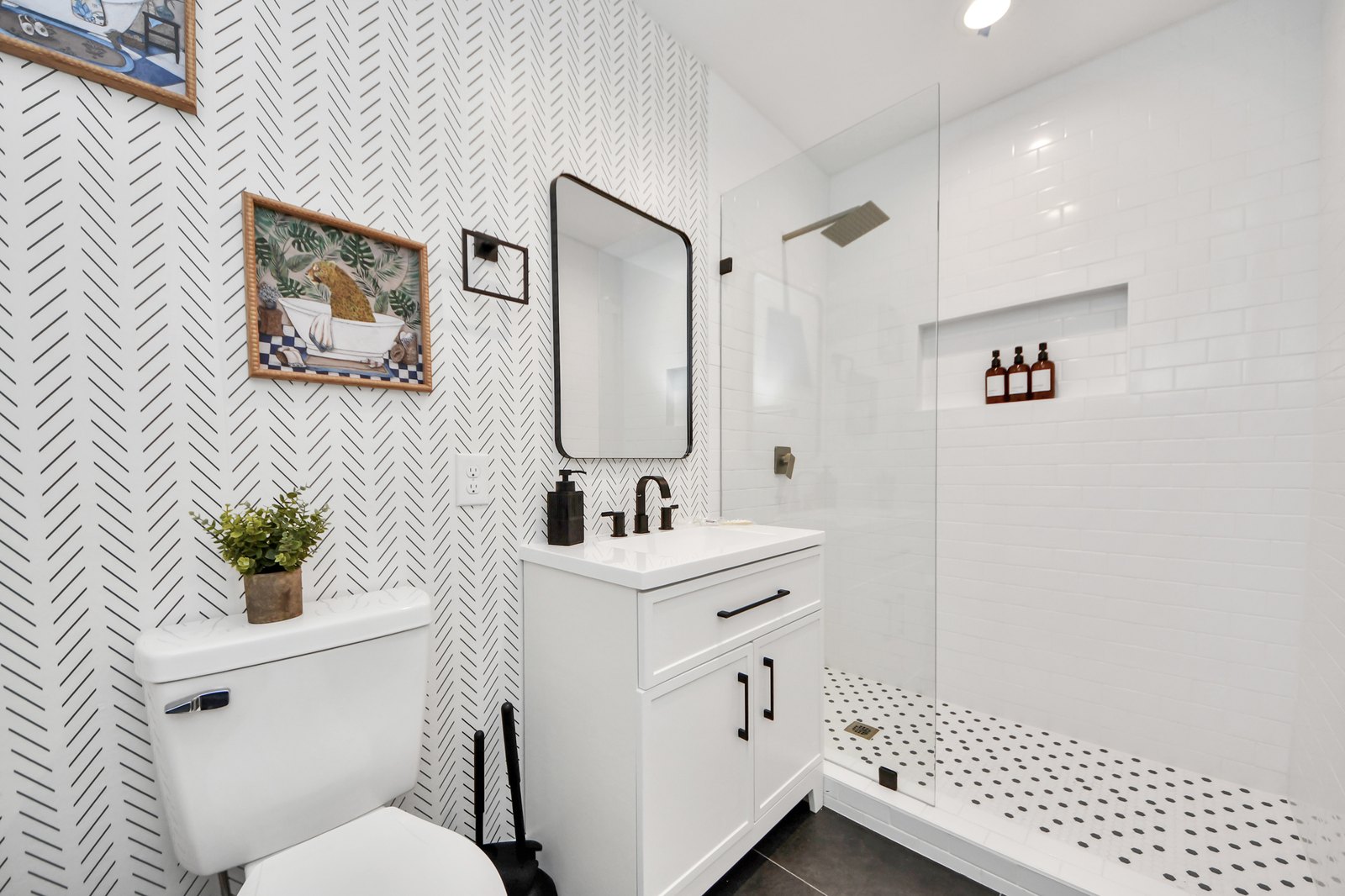 Bright white bathroom with a glass walk-in shower
