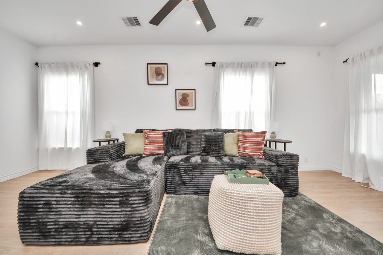 Living room with the plush sectional and rug