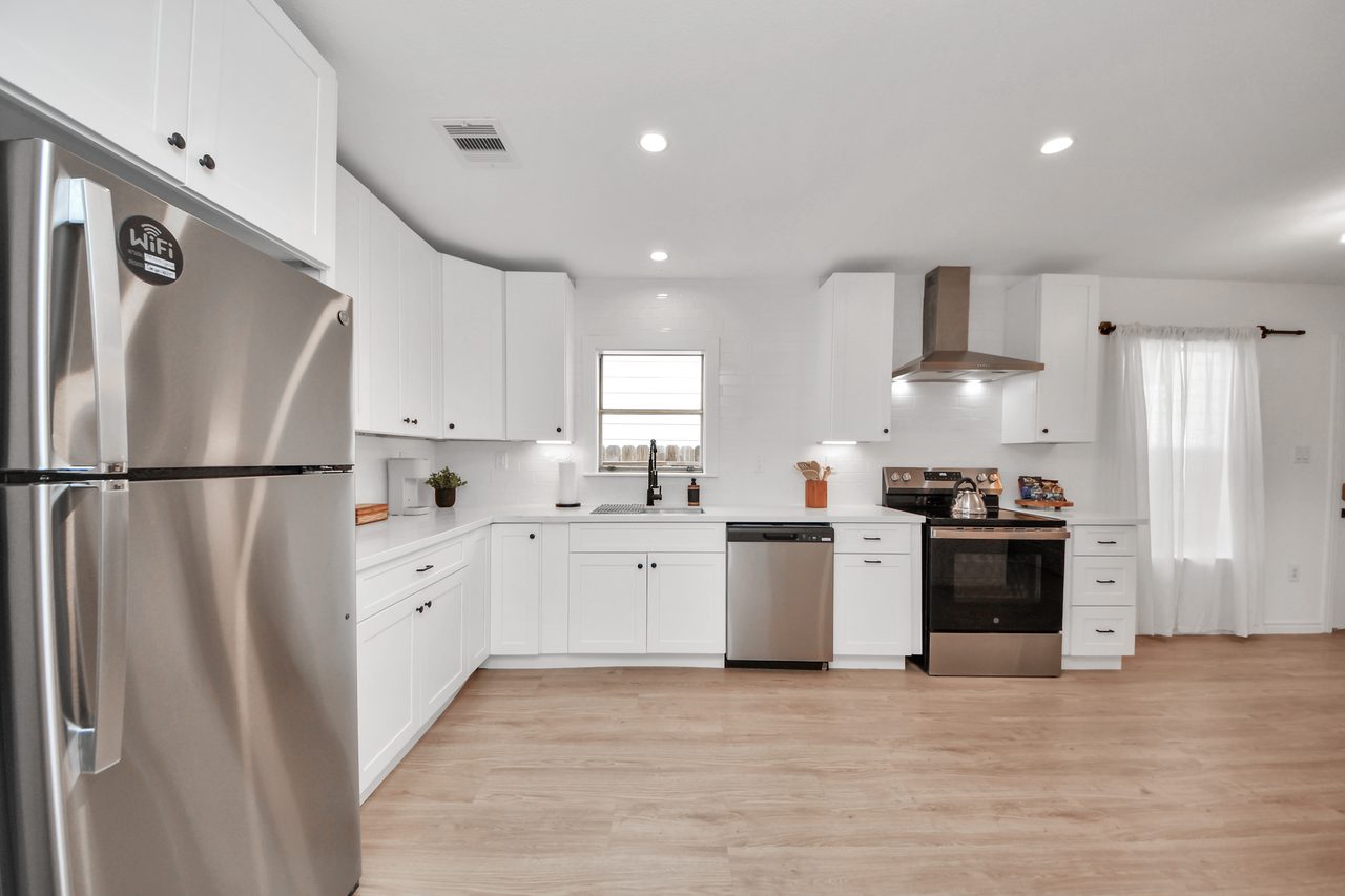 Kitchen with stainless appliances and quartz counters