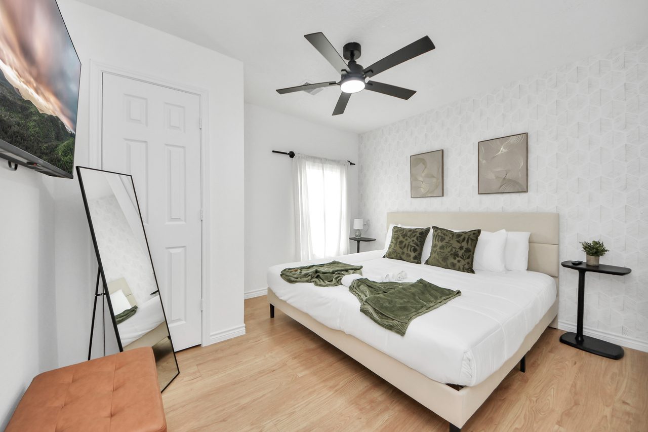 Bedroom with upholstered headboard and bench