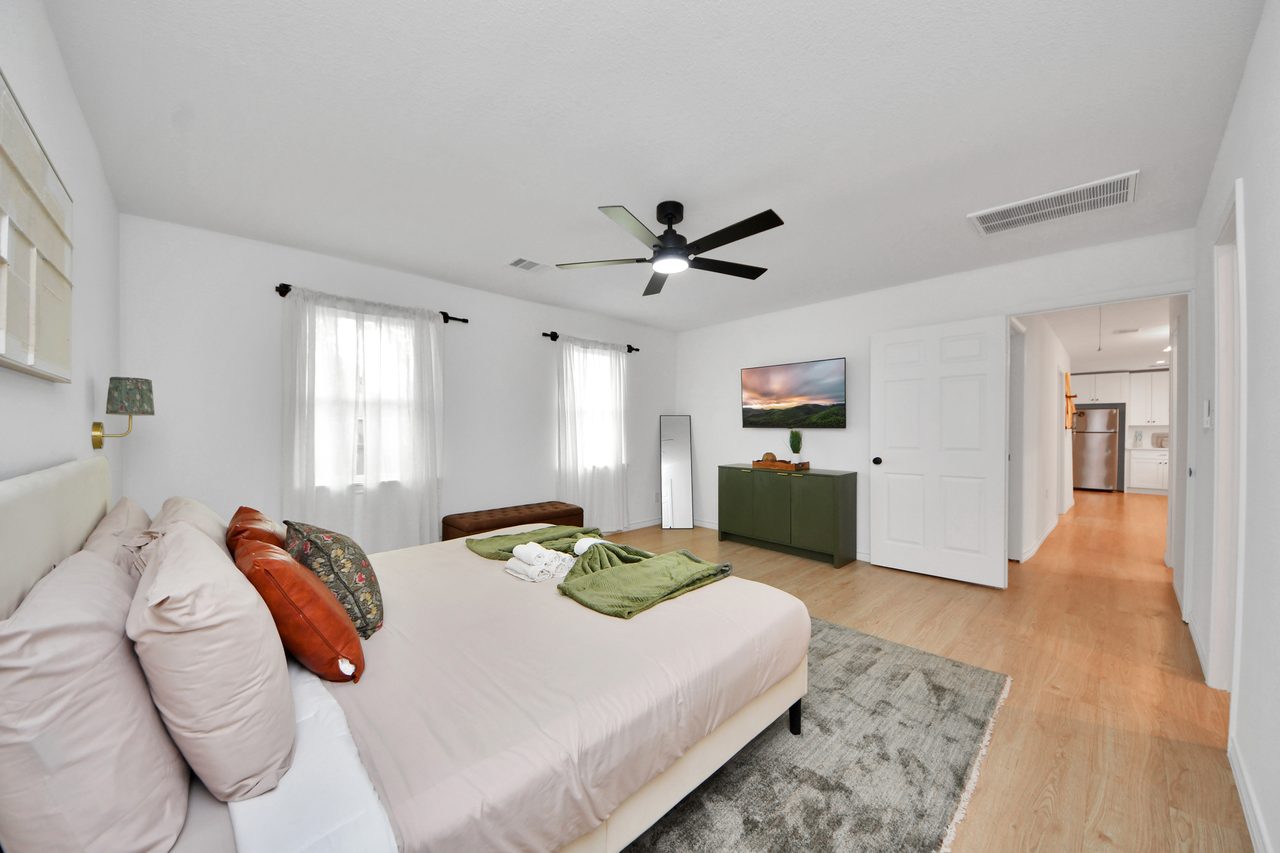 Bedroom styled with rust and green linens