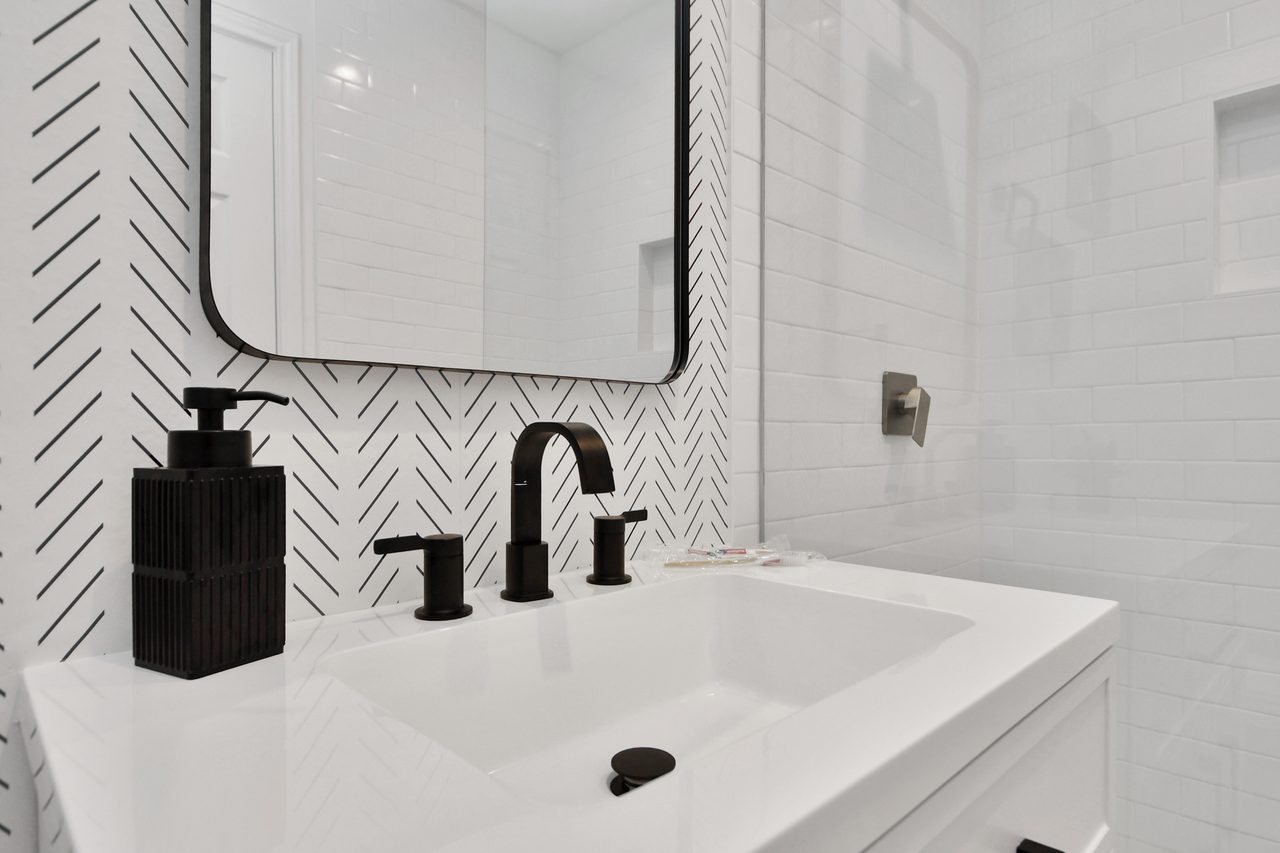 Second bathroom vanity with herringbone tile