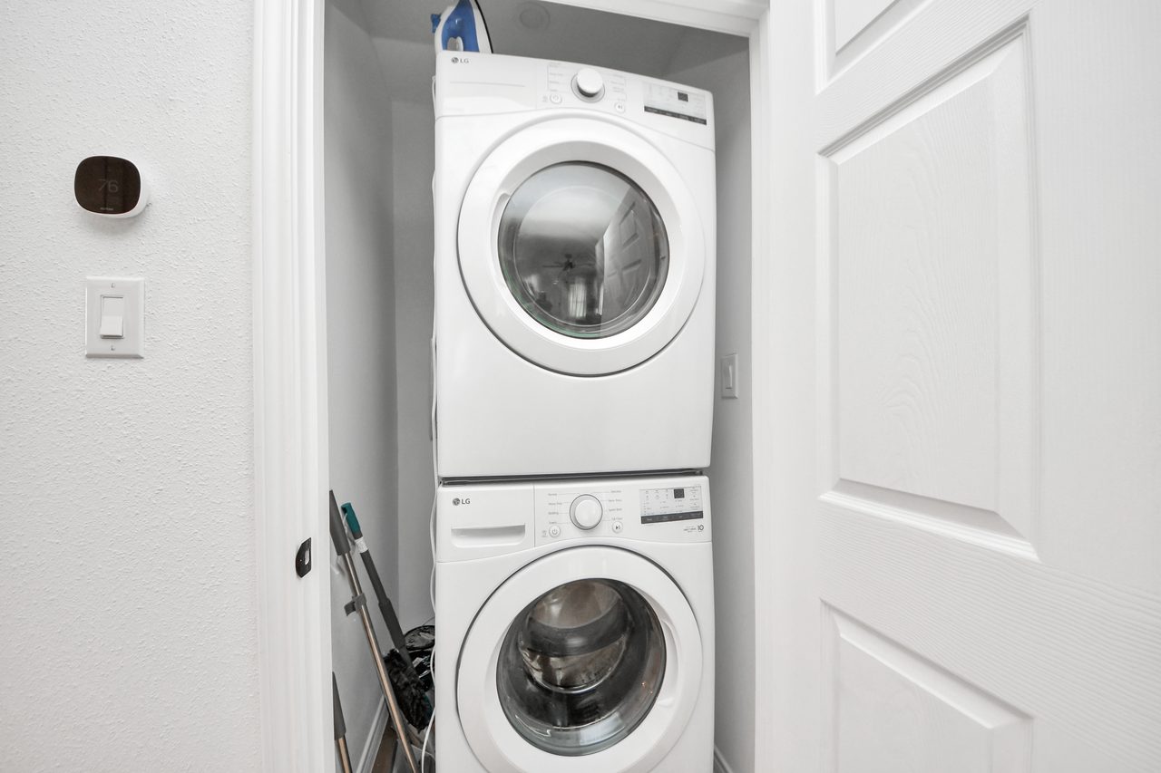 In-unit stacked washer and dryer